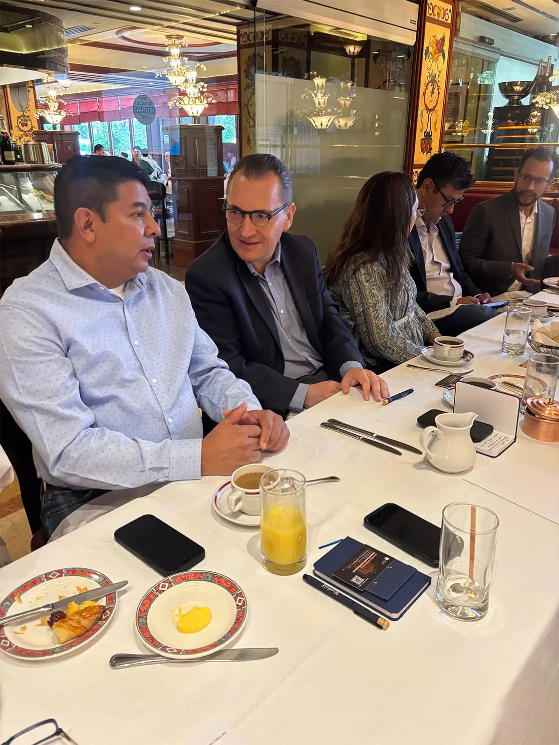Business leaders networking during a Westfield Business School executive leadership event.