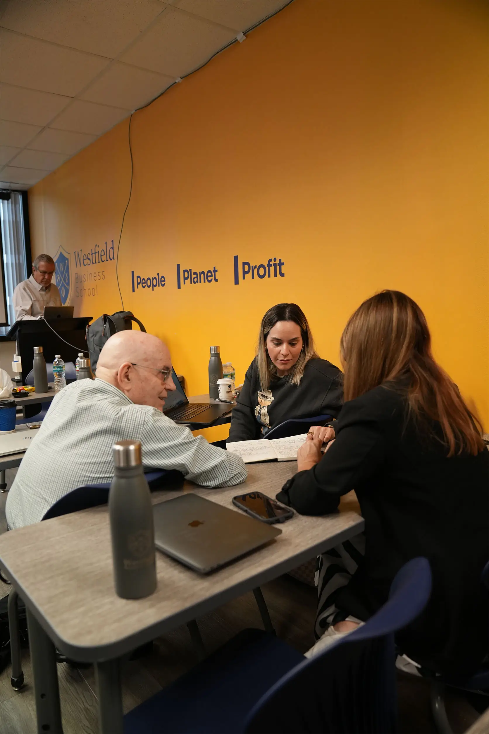 Executives collaborating on applied business challenges at Westfield Business School.